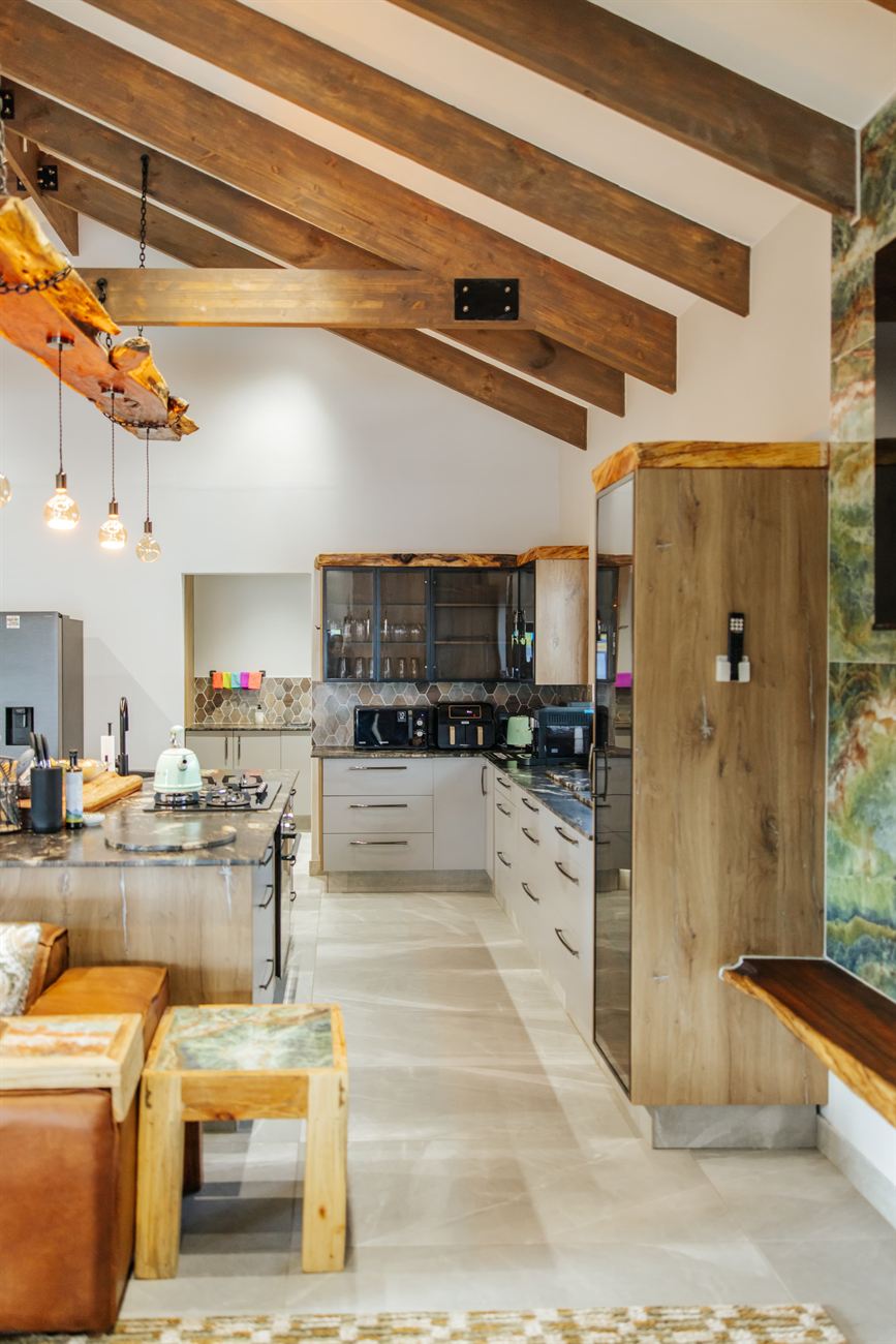Self-catering kitchen beneath reclaimed timber beams